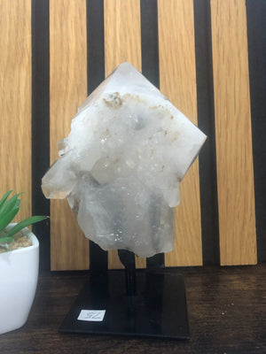 Raw-polished clear Quartz on stand