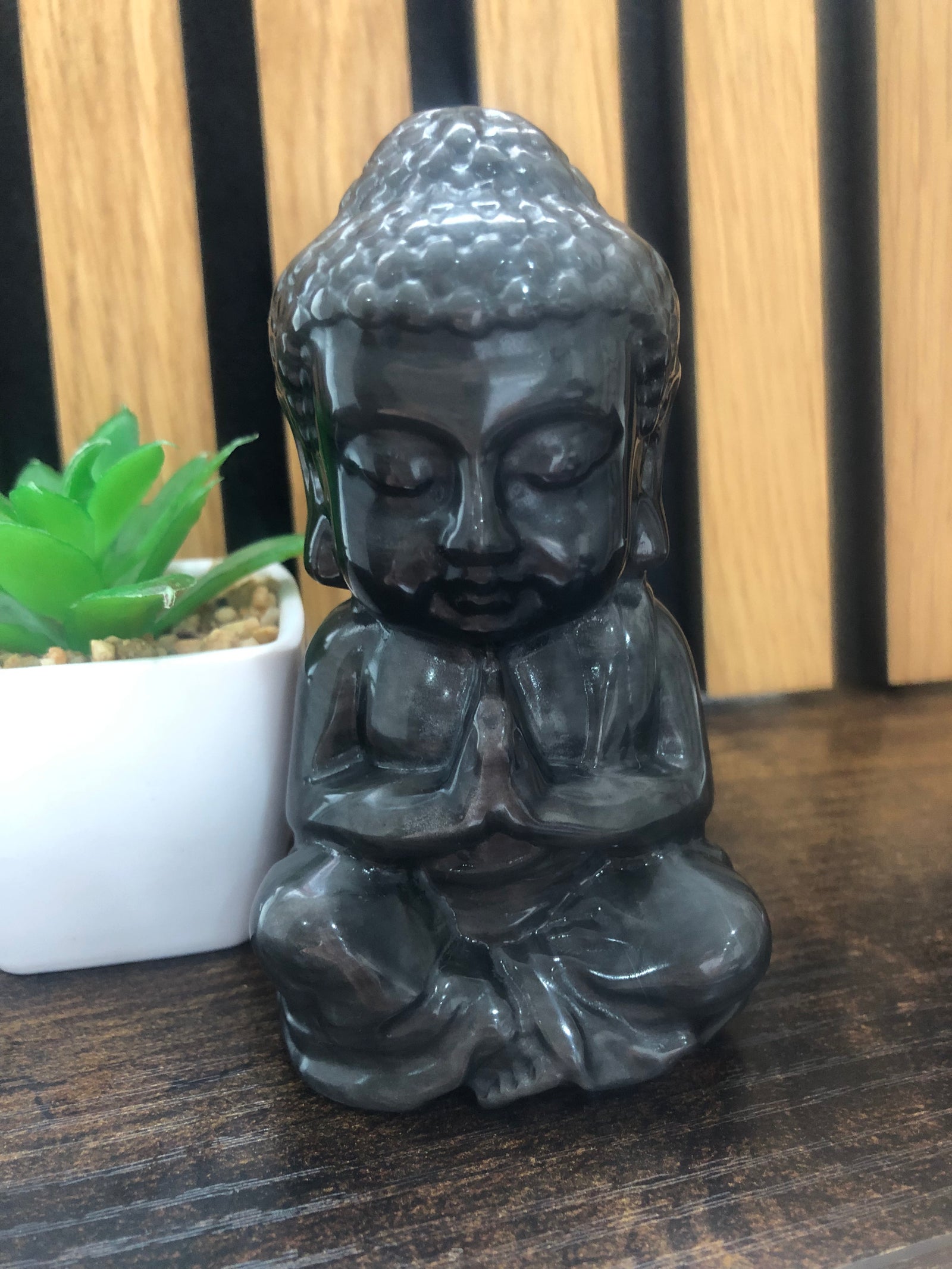 Silver obsidian Buddha