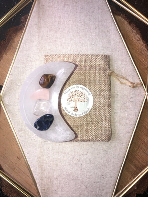 Crystal packs with selenite moon bowl