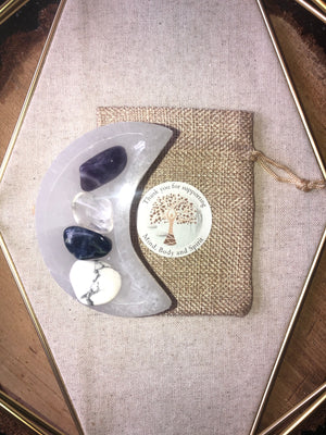 Crystal packs with selenite moon bowl